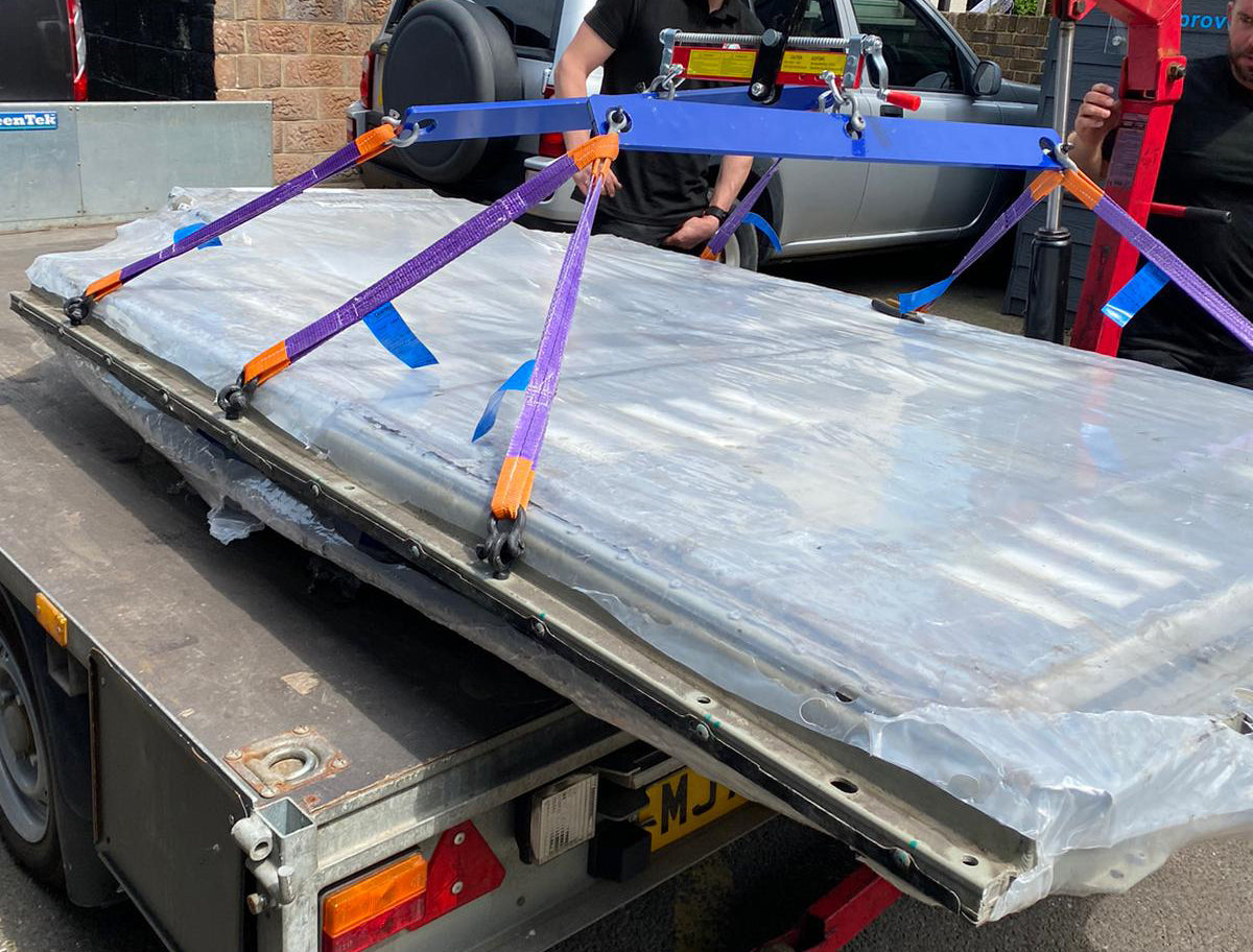 Engine Hoist in use hold tesla model s battery