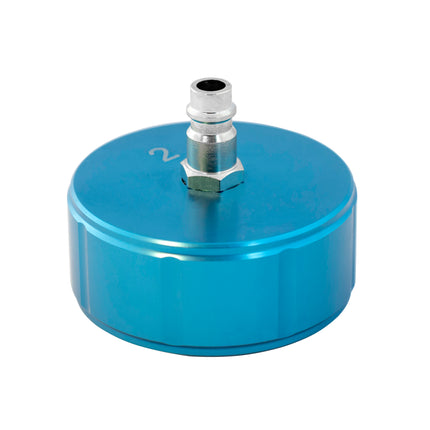 A blue metal cooling system cap with a internal diameter of 60mm, marked no 2